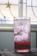 Red soda soft drink with ice