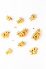 Many fresh green grape clusters isolated on white background.