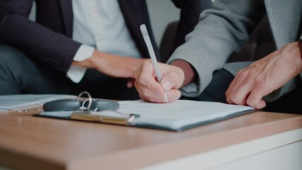 Man hand signs car purchase contract with manager in dealership - Powered by Adobe