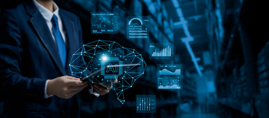 Businessman using tablet with artificial intelligence brain interface and data analytics dashboard in warehouse, representing AI-driven digital transformation in logistics and business operations.