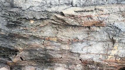 The texture of the rocks with natural cracks depicts solidity.