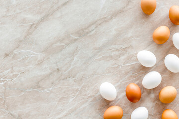 Frame of chicken eggs, top view. Food pattern. Easter background