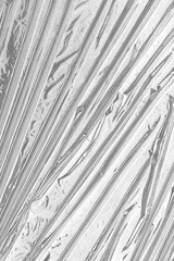 Obraz premium plastic overlay texture of realistic crumpled transparent plastic film wrap on black background,wrinkled stretched plastic effect.