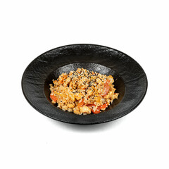 A black bowl filled with vibrant fried rice, mixed with fresh vegetables and topped with sesame seeds