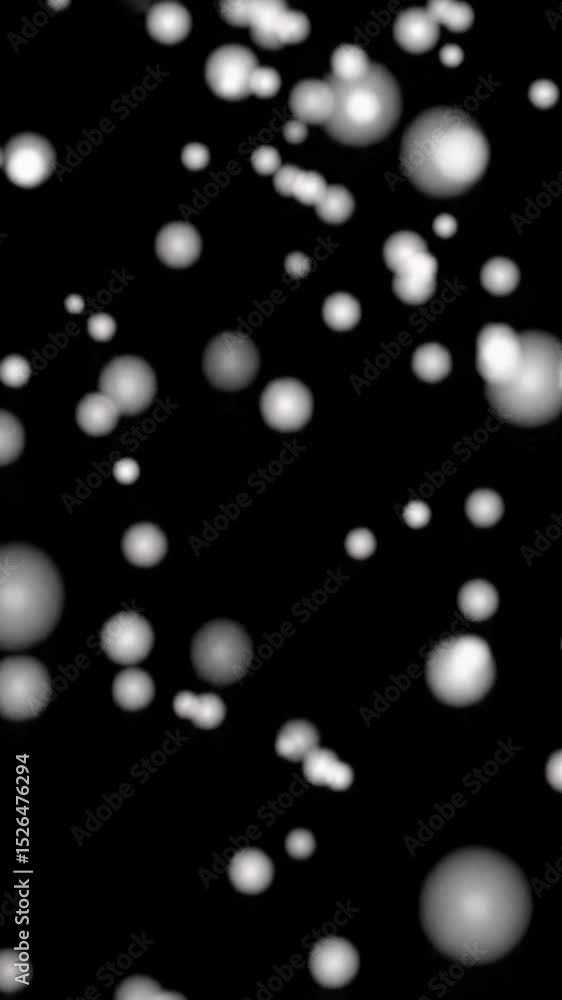 Poster Small, glimmering white particles resembling ethereal dust or soft snowflakes gently drift downwards against an infinite black void with subtle bokeh, creating a serene, minimal, seamless looping