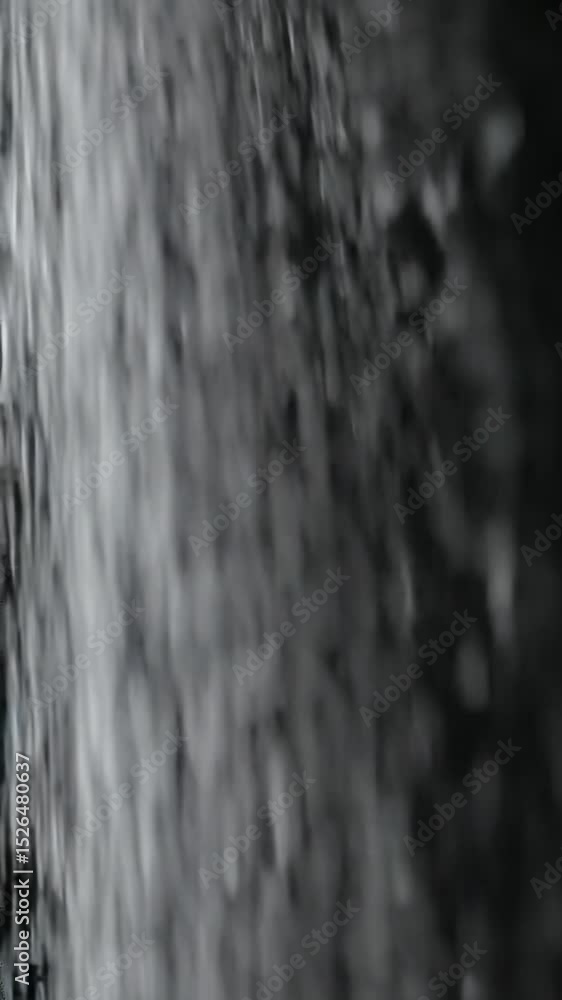 Poster macro close-up video of ethereal white particles, like delicate snowflakes or distant stars, falling