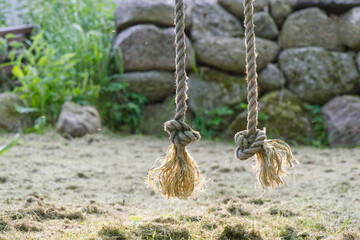 Hanging side with knots for children to play at an outdoor playground