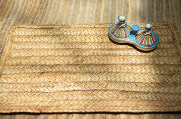 Decorative Tajine from Marrakech displayed on a table with an esparto grass rug