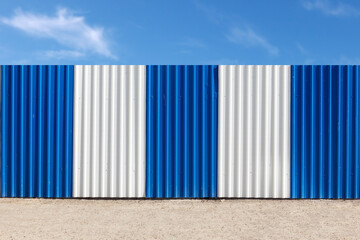 blue-white corrugated metal fence
