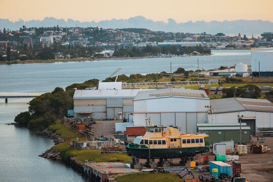 Ferry on blocks under repair in Newcastle industrial area