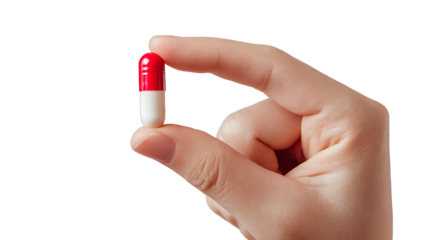 A close-up shows a hand holding a two-colored capsule. The capsule is red on one end and white on the other.