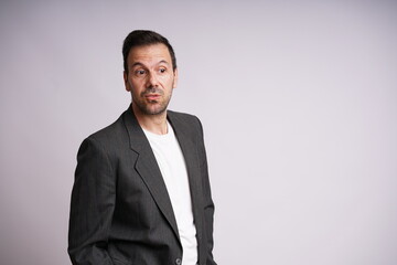 Fototapeta premium Male Model Showing Different Emotions on White Studio Background