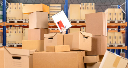Chaos in warehouse. Auditor hand among warehouse boxes. Factory storage area needs order. Chaos in...