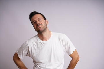 Obraz premium Male Model Showing Different Emotions on White Studio Background