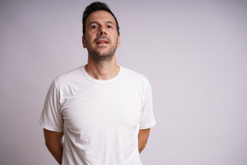 Fototapeta premium Male Model Showing Different Emotions on White Studio Background