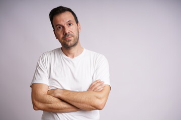 Fototapeta premium Male Model Showing Different Emotions on White Studio Background