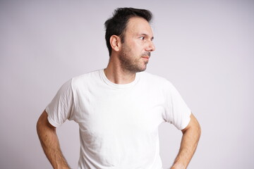 Fototapeta premium Male Model Showing Different Emotions on White Studio Background