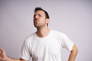 Obraz premium Male Model Showing Different Emotions on White Studio Background