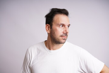 Obraz premium Male Model Showing Different Emotions on White Studio Background