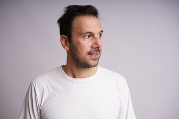 Obraz premium Male Model Showing Different Emotions on White Studio Background