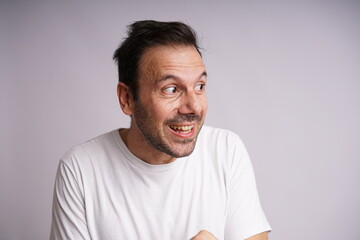 Fototapeta premium Male Model Showing Different Emotions on White Studio Background