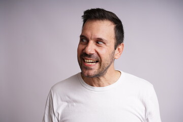 Obraz premium Male Model , mad, Showing Different Emotions on White Studio Background