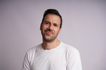 Fototapeta premium Male Model Showing Different Emotions on White Studio Background