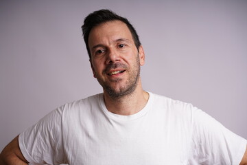 Obraz premium Male Model Showing Different Emotions on White Studio Background