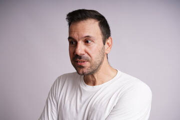 Obraz premium Male Model Showing Different Emotions on White Studio Background