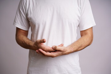 Expressive Male Hands on White Background in Studio Lighting