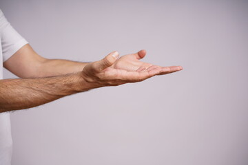 Expressive Male Hands on White Background in Studio Lighting