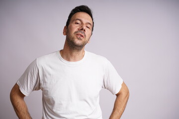 Obraz premium Male Model Showing Different Emotions on White Studio Background