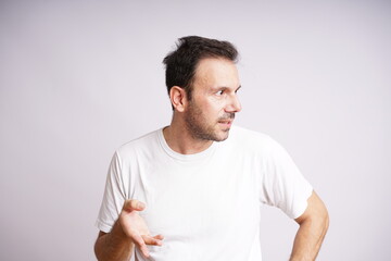 Obraz premium Male Model Showing Different Emotions on White Studio Background