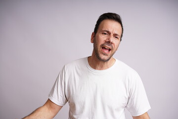 Obraz premium Male Model Showing Different Emotions on White Studio Background, no edit