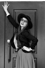 Obraz premium Fashion portrait stylish pretty woman outdoor in hat. Street fashion. Black hat