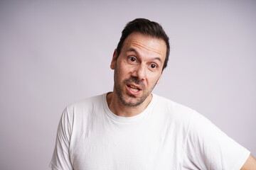 Fototapeta premium Male Model Showing Different Emotions on White Studio Background