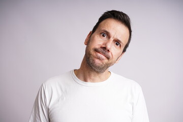 Fototapeta premium Male Model Showing Different Emotions on White Studio Background