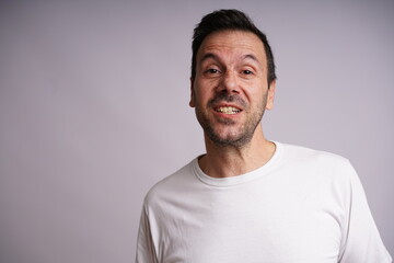 Obraz premium Male Model Showing Different Emotions on White Studio Background
