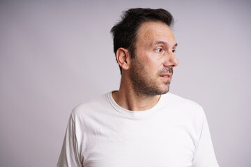 Obraz premium Male Model Showing Different Emotions on White Studio Background