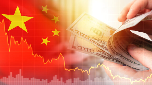 Crisis in China. Hands with money. Chart down metaphor of economic decline. Financial downturn of yuan. Economic crisis in China. PRC flag with stock quotes. Crisis in people republic of China
