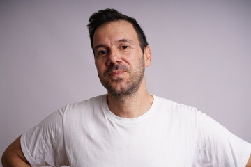 Fototapeta premium Male Model Showing Different Emotions on White Studio Background
