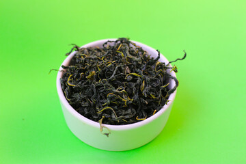 Fototapeta premium Dried mulberry leaves, commonly used for herbal tea and traditional remedies.
