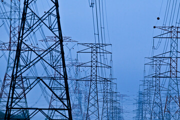Rows of dozens of electricity towers