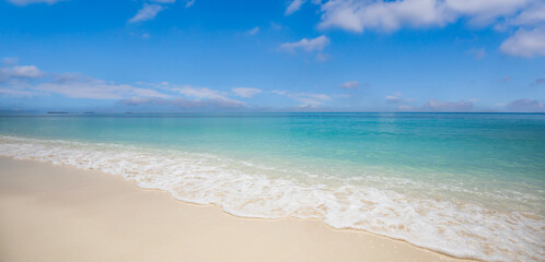 Sunny blue sky sea. Scene tropical beach seascape soft sand closeup, tranquil summer travel vacation backgrounds. Vibrant warm panoramic scene paradise relaxation. Calm waves peaceful nature landscape