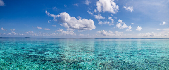 Breathtaking tropical ocean seascape sunny blue sky fluffy clouds. Amazing horizon sea view. Tranquil serene nature scenes travel inspiration relaxing coastal background. Summer nature, Earth panorama
