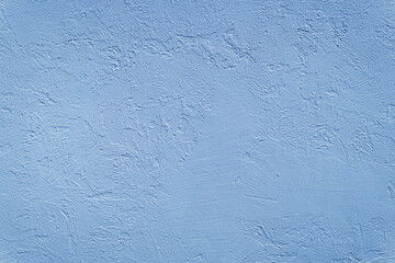 Beautiful uneven blue texture. Neutral decorative background.