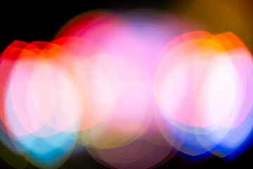 Colorful abstract bokeh background with vibrant circles of light in yellow, red, blue, and purple tones, perfect for creative designs, festive themes, and modern digital art projects