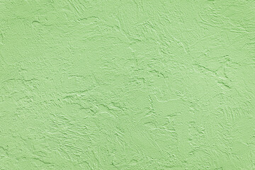 Obraz premium Beautiful uneven green texture. Neutral decorative background.
