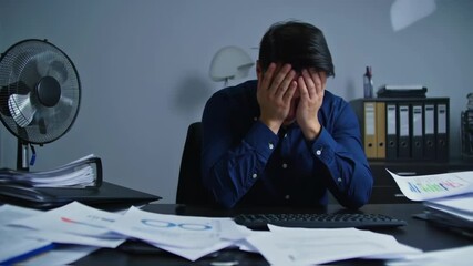 Overwhelmed businessman, stressed at work, surrounded by paperwork. - Powered by Adobe