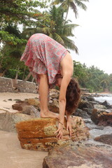 Obraz premium beautiful woman in the beach yoga